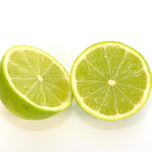 Persian Lime Infused Olive Oil bottle with citrus and greens